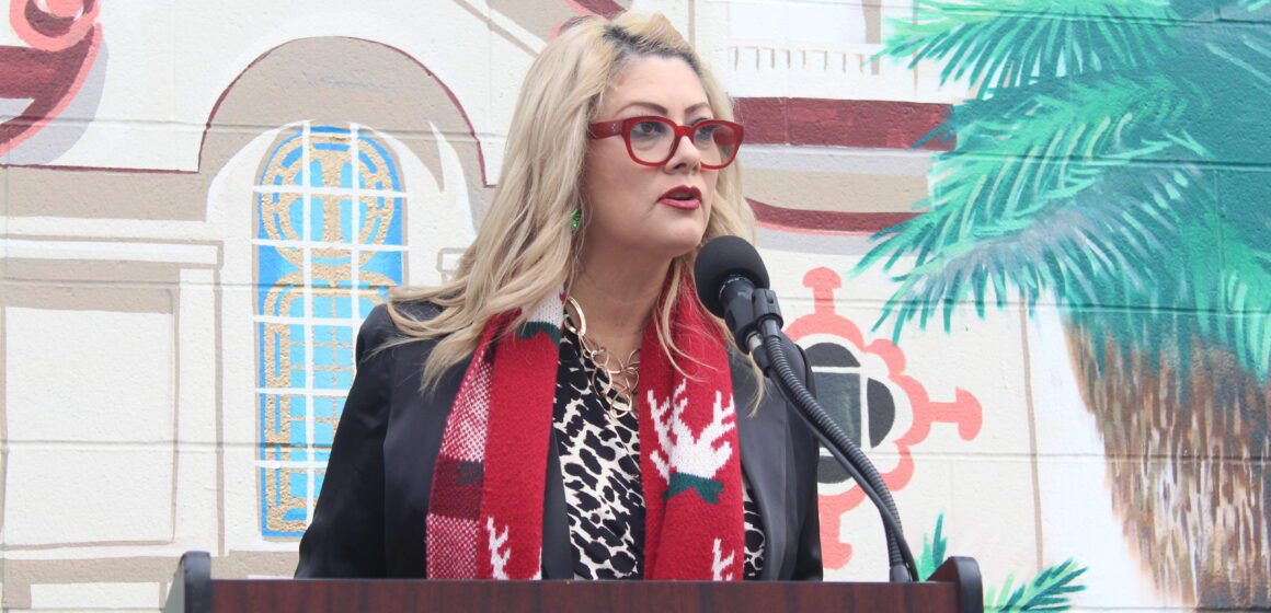 Alum Rock Santa Clara Street Business Association co-president Connie Alvarez shared in Wednesday’s celebration held in front of the Little Portugal mural in East San Jose. Photo by Vicente Vera.