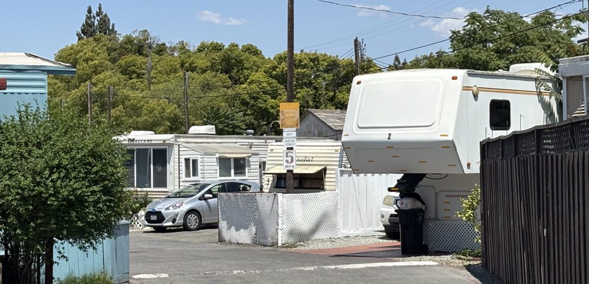 A view of a trailer park on a sunny, blue sky day.