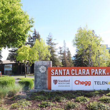 Santa Clara Park entrance sign at Freedom Circle with Stanford health Care, Chegg, and Telenav listed