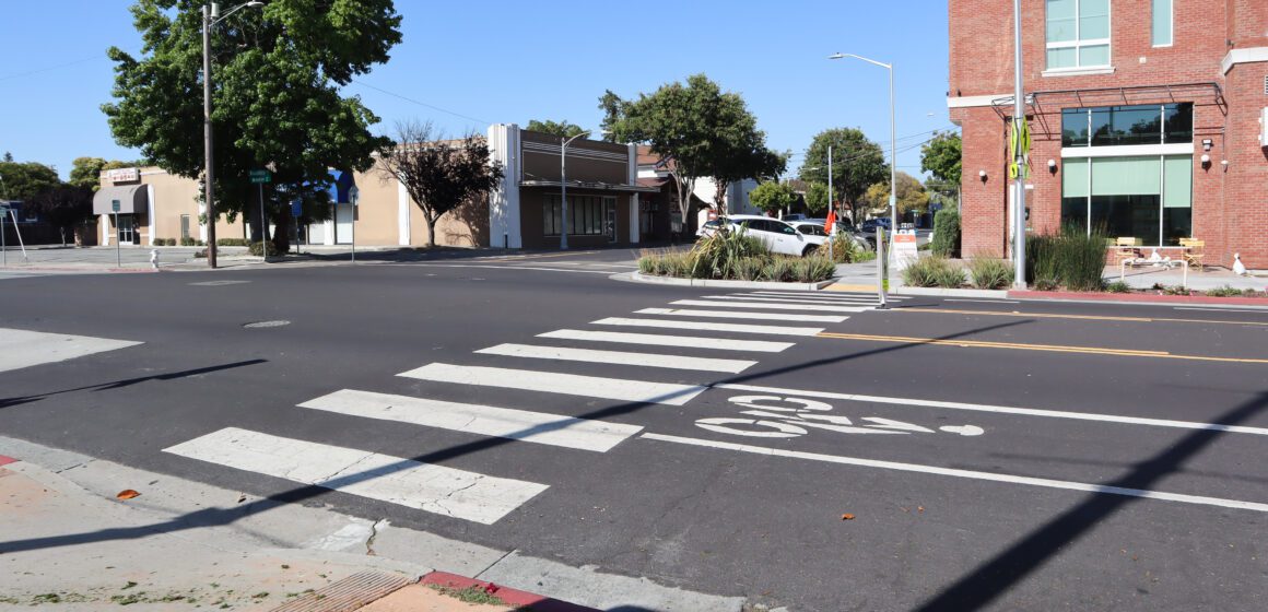 White stripped crosswalk in front of pedestrian mall