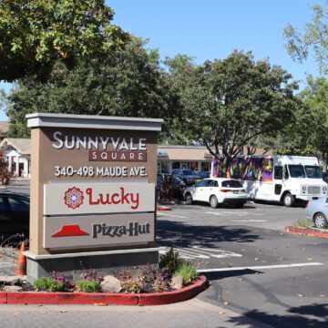 Photo of a parking lot and sign showing the address of Sunnyvale Square, 340-498 Maude Ave, where there's a Lucky Supermarket and Pizza Hut