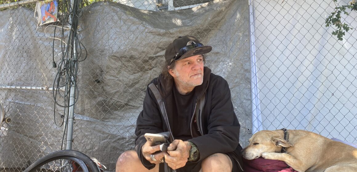 Man outside with dog