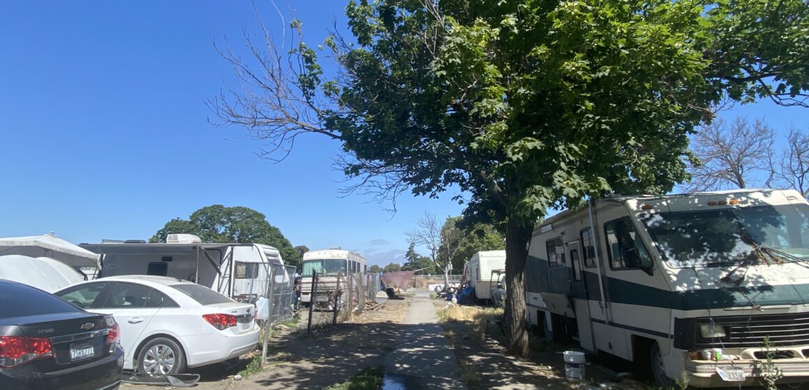 An RV and cars parked at a park in San Jose