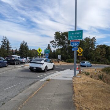 Cars enter an interstate on-ramp