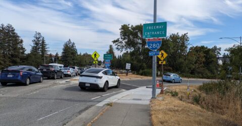 Cars enter an interstate on-ramp