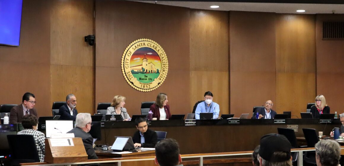 Santa Clara City Council seated at dias with city crest behind