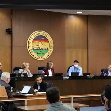 Santa Clara City Council seated at dias with city crest behind