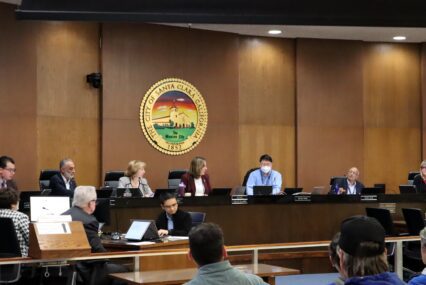 Santa Clara City Council seated at dias with city crest behind
