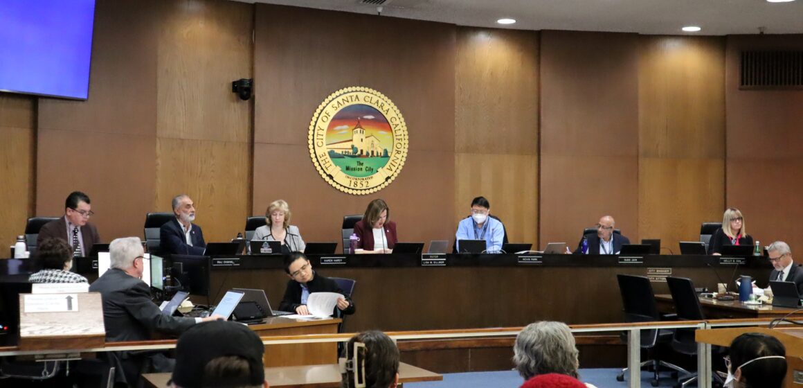 Members of a city council in the meeting chambers