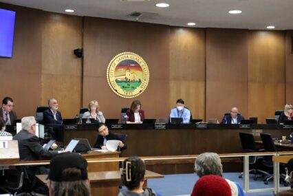 Members of a city council in the meeting chambers
