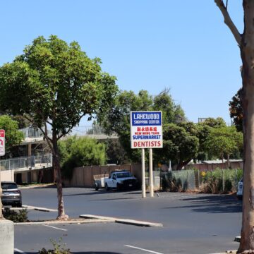 Parking lot around sign for Lakewood Shopping Center