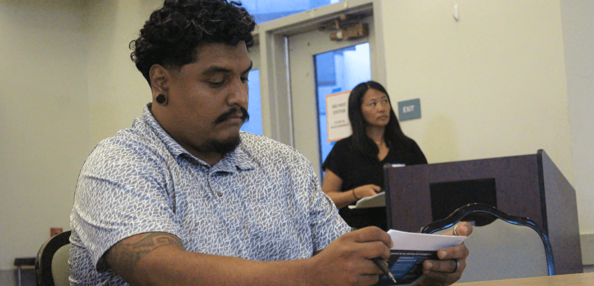 Berryessa Flea Market Advisory Group leader Roberto González watching a city-led presentation on potential new market sites on Sept. 11, 2024. Photo by Vicente Vera.