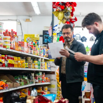 Two men in a grocery story