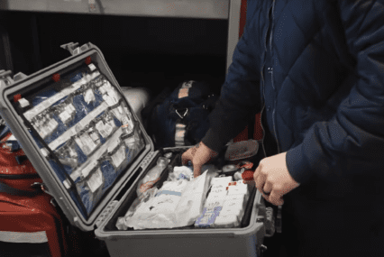 A firefighter with a medication box