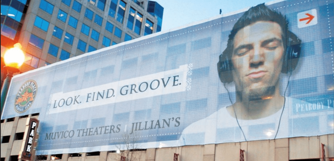 Rendering images of an ad plastered on the side of a building in San Jose.